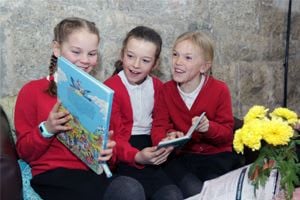 children reading at Wheal Martyn